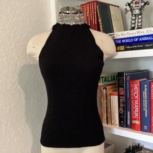 Sleeveless black top Please look at the tag it says petite